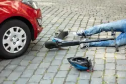 Man,after,accident,on,electric,scooter,overrun,by,car