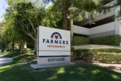 Farmers insurance sign and trees