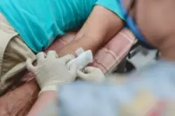 Bandage being placed on arm